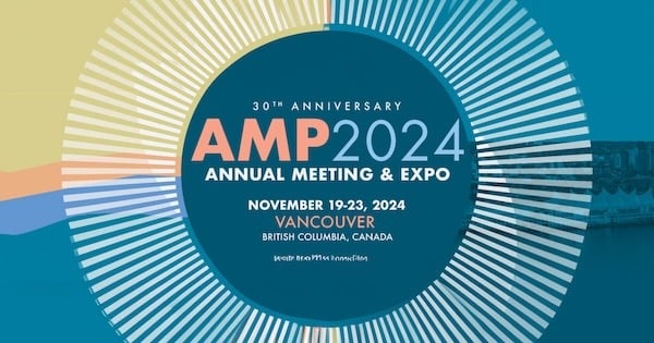 AMP 2024 Annual Meeting & Expo promotional graphic. The event celebrates the 30th anniversary and will be held from November 19-23, 2024, in Vancouver, British Columbia, Canada. The graphic features a circular design with multi-colored stripes radiating outward, and the main text is centered over a teal and blue background. The event details are in bold, with the venue and dates highlighted in orange. The bottom of the graphic includes a website link.