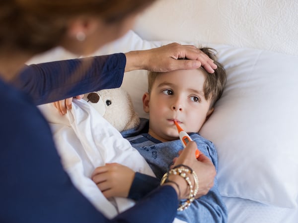 Boy measuring a fever