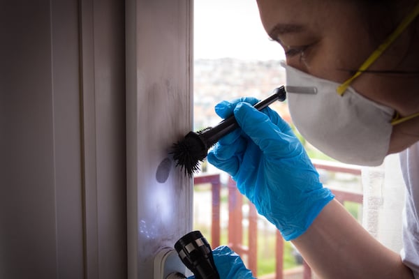 Forensic experts finds fingerprints on the window - How to Swab for Touch DNA Evidence