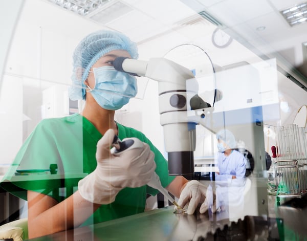 Scientist using microscope in the laboratory